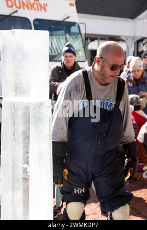 Newport, RI. Jan. 25, 2024. Sean Skelly of Attleboro, MA and Sam Sannie of Easton, MA carved three creations at Long Whark in downtown Newport, RI: a vase on a pedastel, a swan and a fish, in front of the crowd, as part of the Newport Winter Festival 2024. @ Veronica Bruno / Alamy Live News Stock Photo