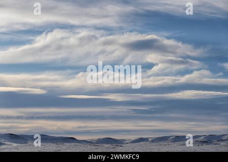 Late afternoon clouds and light over the Frenchmen River Valley in Grasslands National Park; Val Marie, Saskatchewan, Canada Stock Photo