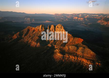 Cliffs and terraces and colorful layers of rock are illuminated on an aerial photograph revealing the steps of Grand Staircase-Escalante National M... Stock Photo