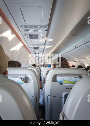 Picture of the interior cabin of an Air Baltic A220 in Riga. airBaltic, legally incorporated as AS Air Baltic Corporation, is the flag carrier of Latv Stock Photo