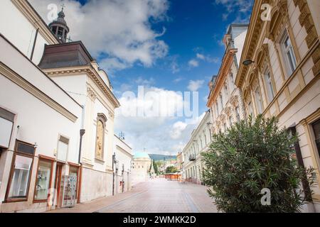 Picture of the pedestrian street irgalmasok utcaja of Pecs, Szechenyi ter square street, at dusk, in Pecs, Hungary. Pécs is the fifth largest city in Stock Photo