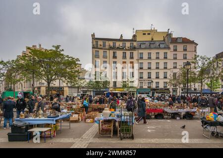 Paris, France - May 14, 2023: many tourist walking and shopping at Aligre Market in Paris Stock Photo