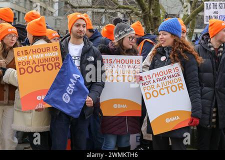 London, UK. 26th Feb, 2024. Protesters hold placards expressing their opinion during the demonstration. Members of the British Medical Association (BMA) staged their 10th junior doctors strike action over pay conditions outside St Thomas Hospital in Westminster. Tens of thousands of hospital appointments are with cancelled or postponed due to the industrial action by the junior doctors. Credit: SOPA Images Limited/Alamy Live News Stock Photo