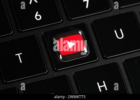 Dallas, TX USA - February 24, 2024: Youtube logo red button on Y key on laptop keyboard. Tech giant Google focuses on AI, search, software, and more, Stock Photo