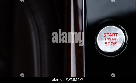 Start engine stop button Interior of modern luxury car. Details of automatic transmission gear shift, multimedia control system, car control panel, Air Vent Red emergency button and dashboard inside. Prestige sport automobile. Selective focus Stock Photo