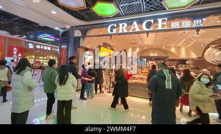 SHANGHAI, CHINA - FEBRUARY 25, 2024 - Consumers line up to buy at GRACE Bakery in Shanghai, China, February 25, 2024. Stock Photo