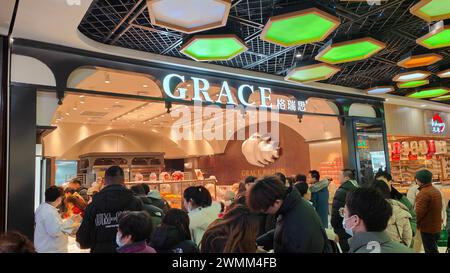 SHANGHAI, CHINA - FEBRUARY 25, 2024 - Consumers line up to buy at GRACE Bakery in Shanghai, China, February 25, 2024. Stock Photo