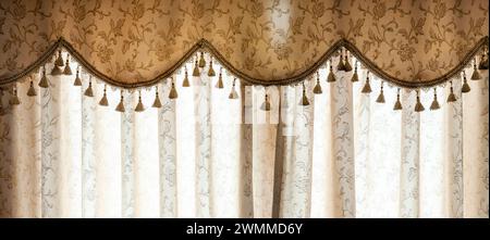Luxurious curtains closed on window at home Stock Photo