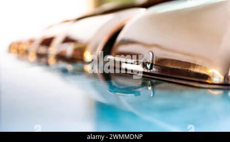 Group of buffet heated trays in a line ready for service Stock Photo