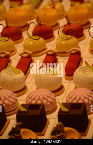 A variety of cakes on white plate on the table Stock Photo