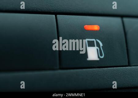 Empty fuel warning light in car dashboard, shallow depth of field Stock Photo