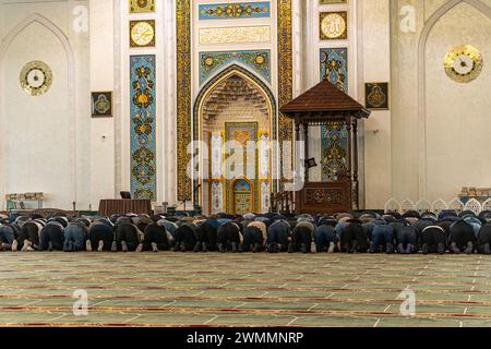 The muslim prayer for god in the mosque. Muslims people is on his knees praying. Holy month of Ramadan Muslims. Moslem Stock Photo