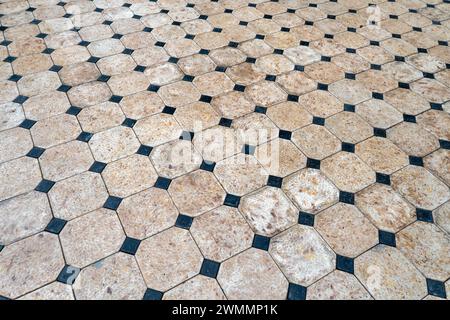 Wet stone pavement in a street. Road surface in urban environment Stock Photo
