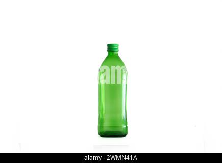 Large green empty glass bottle isolated on white. Stock Photo