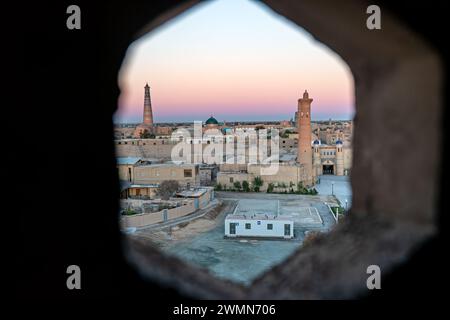 Old town of Khiva from above at sunrise view through the window of the minaret in the mosque Stock Photo
