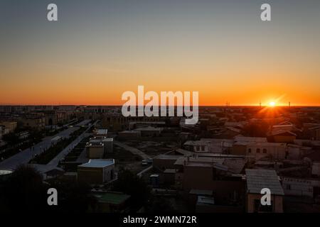 Old town of Khiva from above at sunrise. view through the window of the minaret in the mosque Stock Photo