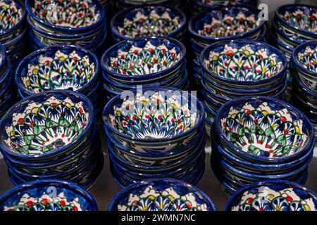 Bukhara. Uzbekistan. Shopping place. Ceramic cups and bowls decorated by traditional uzbek patterns. Blue pattern. lots of cups of blue color on the b Stock Photo