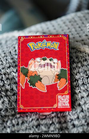 A close-up of a Pokemon playing card on a blanket Stock Photo