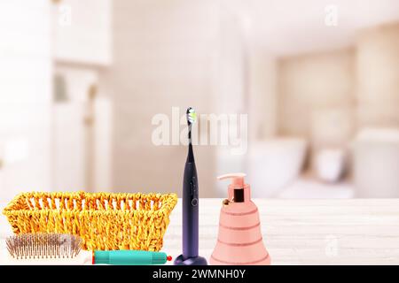 Bath accessories of female cosmetics for healthy look and a empty basket on table over abstract blurred bathroom. Beauty and Wellness concept. Copy sp Stock Photo