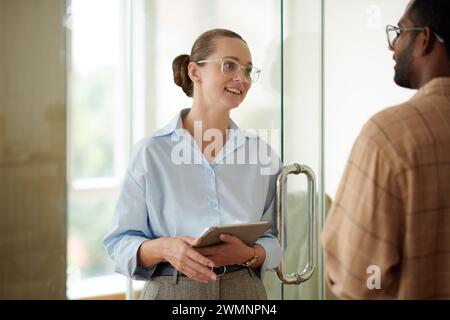 Smiling company cfo talking to head of development department Stock Photo