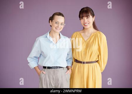 Studio portrait of happy smiling female coworkers Stock Photo