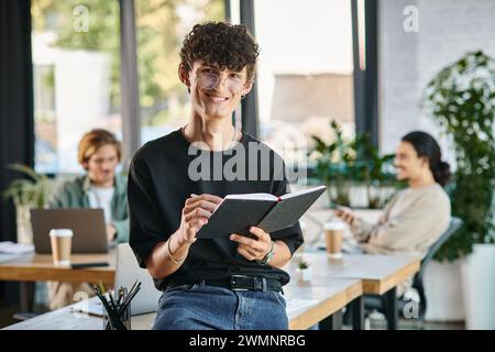 happy  and curly-haired man smiling and taking notes in a dynamic office space, startup ideas Stock Photo
