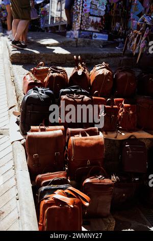 leather bags and backpacks are sold on the street Stock Photo