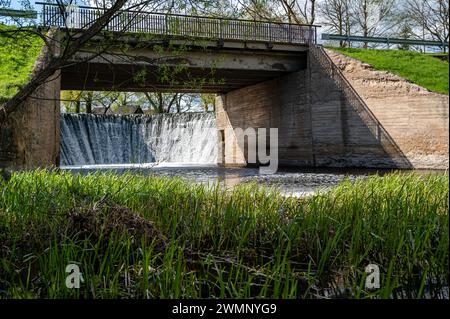 Water flowing from a dam on a small river in Zagare, Lithuania Stock Photo