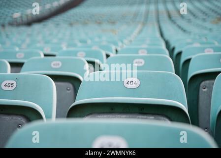 Error 404: seat not found. Rows of blue seats with numbers in a stadium. Stock Photo