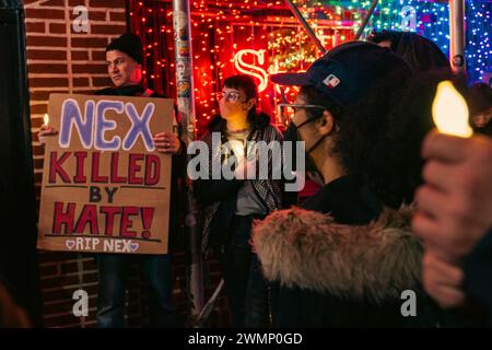 People hold a vigil outside The Stonewall Inn to mourn the death of ...