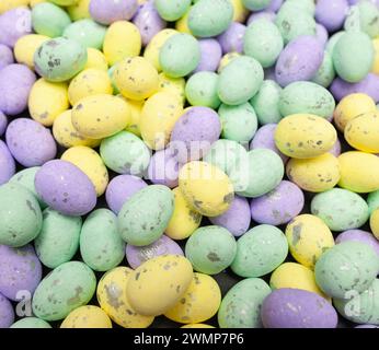 Colourful easter eggs on black background. Creative easter composition, spring. Stock Photo
