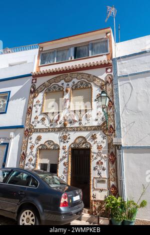 House In Old Town Albufeira With Exterior Walls Decorated With Seashells, Albufeira Old Town, Portugal, February 20, 2024 Stock Photo