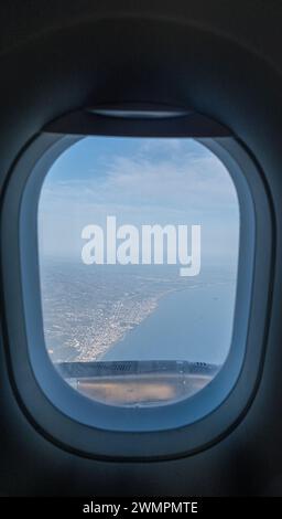 View from window of airplane during flight at beautiful sunrise. Stock Photo