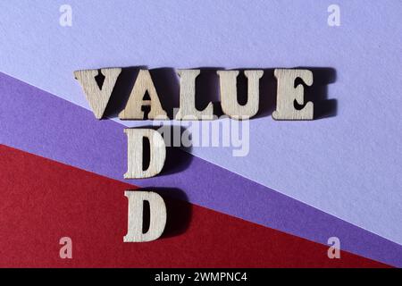 Value Add, words in wooden alphabet letters in crossword form isolated on background Stock Photo