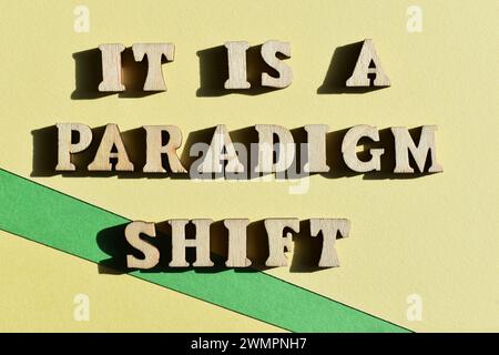 It Is A Paradigm Shift, words in wooden alphabet letters isolated on background, meaning a fundamental change in approach or underlying assumptions Stock Photo