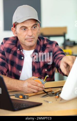 senior man using computer on work table Stock Photo
