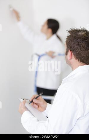 workers discuss renovation project using digital tablet Stock Photo