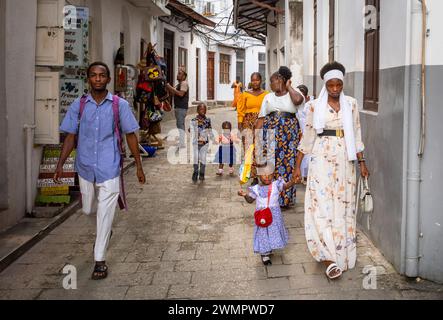 Catholics dressed in Sunday Best arrive at St Joseph's Cathedral for Sunday Mass in Stone Town, Zanzibar, Tanzania Stock Photo