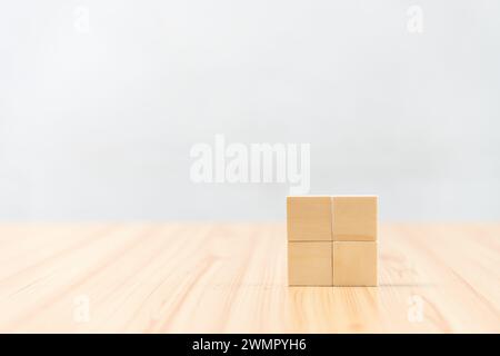 Cubes stacked on a table in geometric arrangement Stock Photo