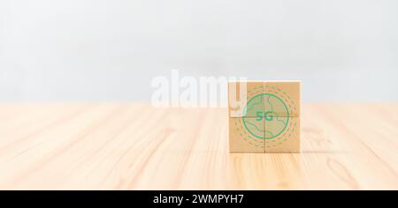 A cube on a wooden table with a globe image Stock Photo