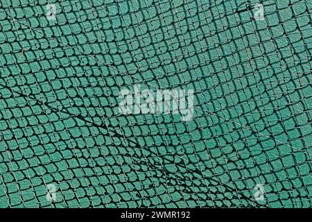 Green mesh, rhombus grid on green background Stock Photo