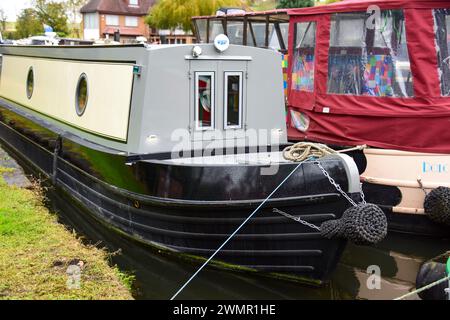 Narrowboat on a mooring on a canal on the UK's inland waterways. Stock Photo