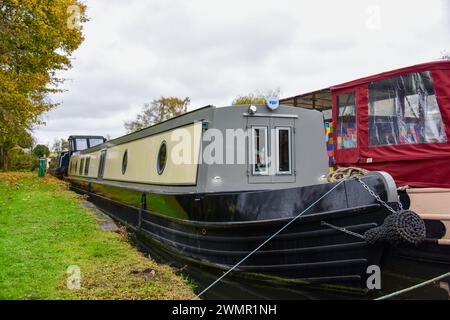 Narrowboat on a mooring on a canal on the UK's inland waterways. Stock Photo