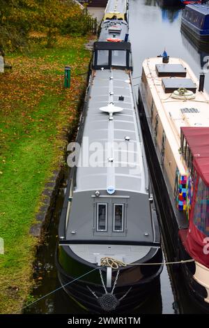 Narrowboat on a mooring on a canal on the UK's inland waterways. Stock Photo