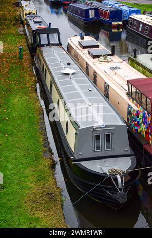 Narrowboat on a mooring on a canal on the UK's inland waterways. Stock Photo