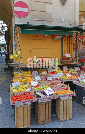 Sorrento, Italy - June 26, 2014: Fresh Fruits and Vegetables in Crates at Corner Grocery Shop in Town. Stock Photo