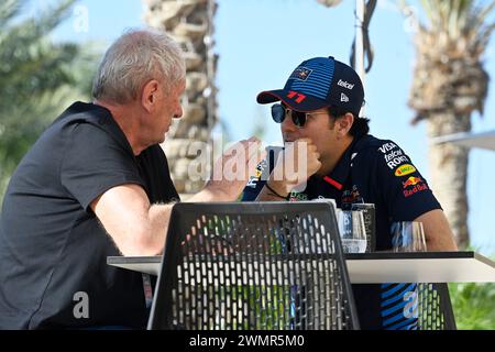 Sakhir, Bahrain. 21st Feb, 2024. BAHRAIN, Sakhir, February 21: Dr. Helmut MARKO, former F1 pilot and consultant to Red Bull in talks with Sergio PEREZ Mendoza, MEX, Oracle Red Bull Racing RB19 during day one of F1 Testing at Bahrain International Circuit on February 21, 2024 in Bahrain, Formula 1 pre season tests, picture & copyright Jerry ANDRE/ATP images (ANDRE Jerry/ATP/SPP) Credit: SPP Sport Press Photo. /Alamy Live News Stock Photo