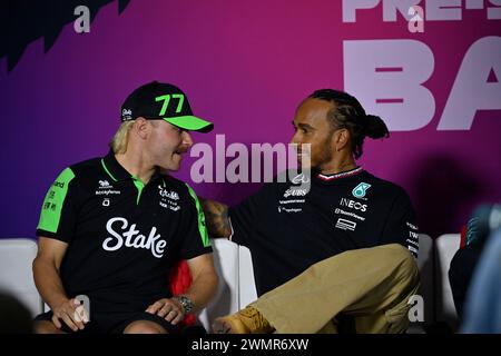 Sakhir, Bahrain. 22nd Feb, 2024. BAHRAIN, Sakhir, February 22: Valtteri BOTTAS, FIN, Stake SAUBER F1 Team and Lewis HAMILTON, GBR, Mercedes AMG F1 Team during day two of F1 Testing at Bahrain International Circuit on February 22, 2024 in Bahrain, Formula 1 pre season tests, picture & copyright Jerry ANDRE/ATP images (ANDRE Jerry/ATP/SPP) Credit: SPP Sport Press Photo. /Alamy Live News Stock Photo