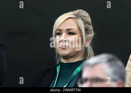 First Minister Michelle O'Neill stands for the national anthem before