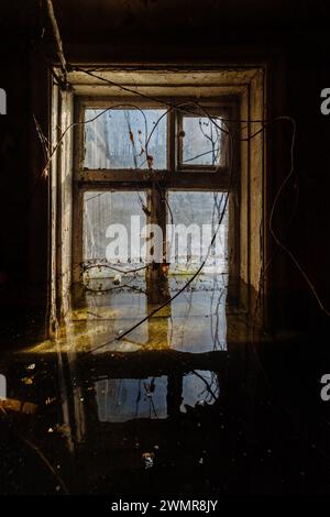 Flooded old house. Flooded old window. Natural disaster concept. Stock Photo